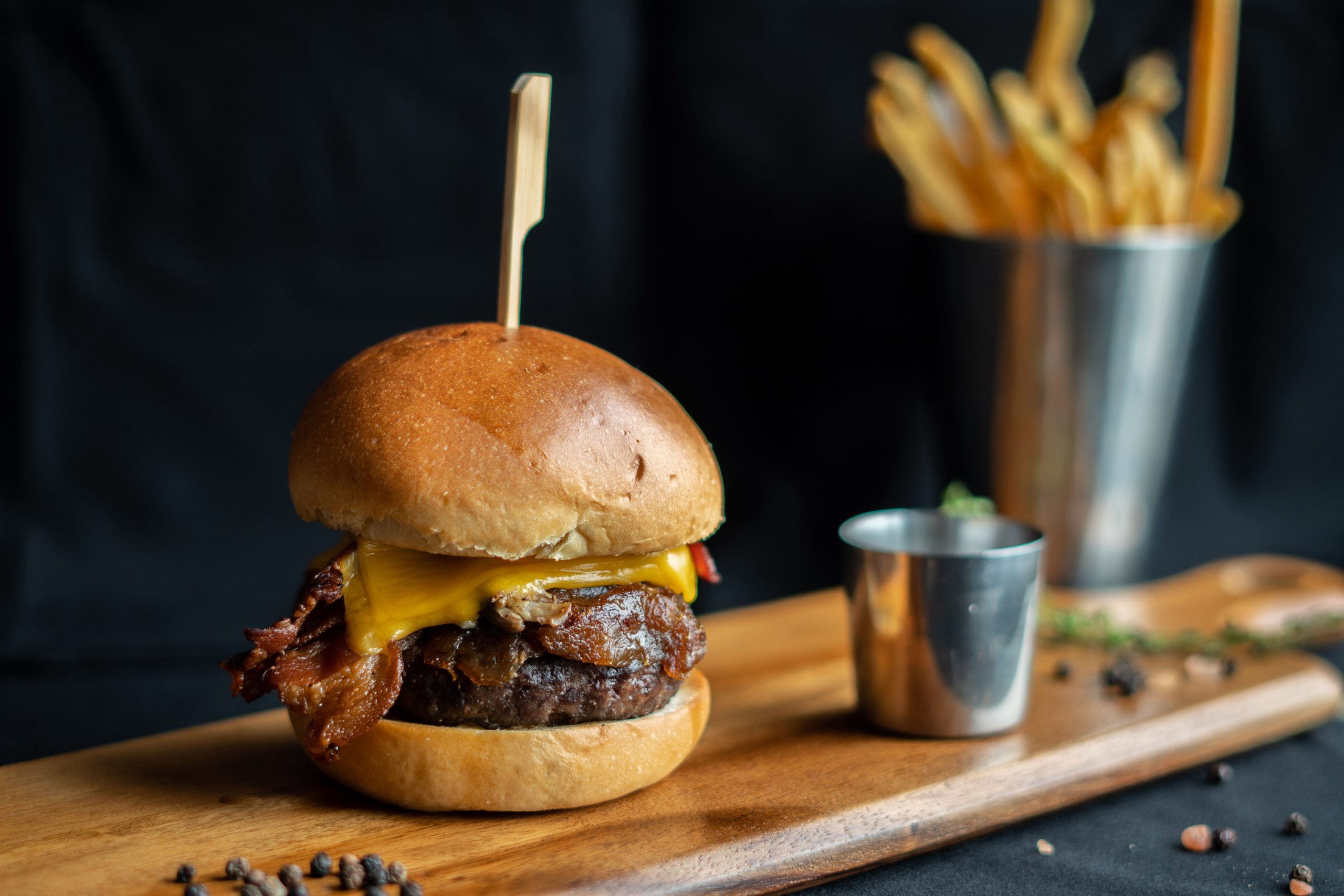Beef Burger with french fries on wooden board