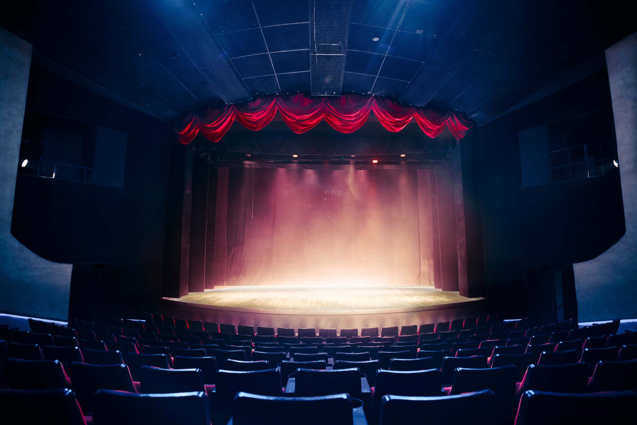 Theater curtain and stage with dramatic lighting