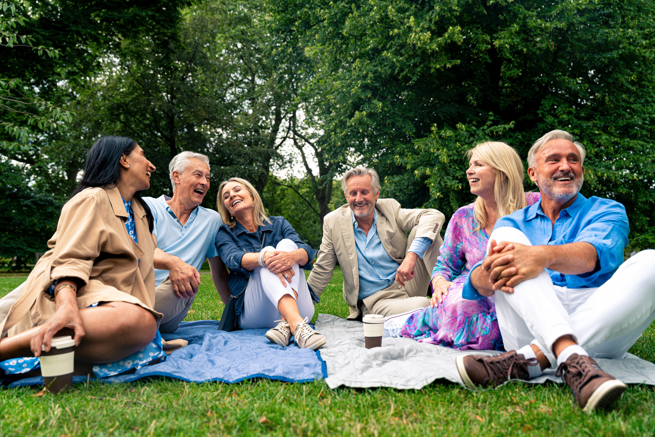 Group of old friends spending time together in the main parts of London, visiting the Westminster area and St. James Park. Old buddies reunion. Concept about third age and seniority